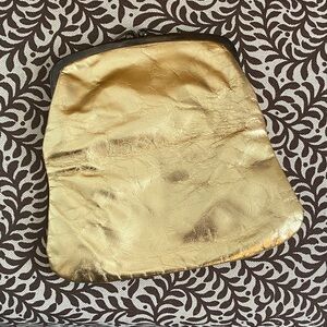 Gold Leather Clutch/Purse. Metal trim.